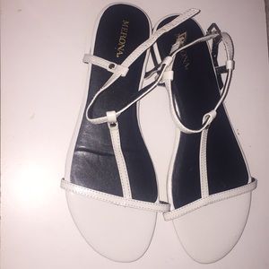 white sandals with gold detailing